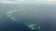 Ein letzter Blick auf das ringförmige Atoll, bevor es über Guam, Manila und Abu Dhabi nach Hause geht.